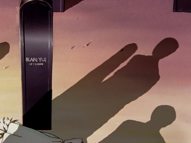 Gendo e Shinji davanti alla tomba di Yui